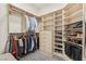 Organized walk-in closet with custom shelving and ample storage solutions at 9144 Las Manaitas Ave # 201, Las Vegas, NV 89144