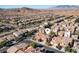 Aerial view of a neighborhood featuring a two-story home with a tile roof and two-car garage at 9869 White Lilac St, Las Vegas, NV 89178