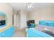 bedroom boasts playful, vibrant decor, carpet, and ample natural light creating a cheerful atmosphere at 9869 White Lilac St, Las Vegas, NV 89178