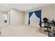 Expansive bonus room with plush carpeting, natural light, and flexible layout at 9869 White Lilac St, Las Vegas, NV 89178