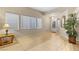 Bright foyer with tiled floor, large windows, and stylish decorative accents at 9869 White Lilac St, Las Vegas, NV 89178