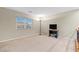 Hallway space showcasing neutral walls, plush carpet, and a window allowing natural light at 9869 White Lilac St, Las Vegas, NV 89178