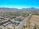 An aerial view of a suburban neighborhood showcases the layout and surrounding landscape at 1005 Warsaw Ave, Henderson, NV 89015