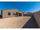 A new construction home featuring a covered patio and a large, private backyard at 1005 Warsaw Ave, Henderson, NV 89015