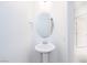 A well-lit powder room featuring a pedestal sink and modern fixtures at 1005 Warsaw Ave, Henderson, NV 89015