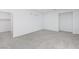 Bright bedroom with plush carpeting, neutral walls, and three narrow windows at 1005 Warsaw Ave, Henderson, NV 89015