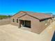 A new construction home featuring a covered patio and a large, private backyard at 1005 Warsaw Ave, Henderson, NV 89015