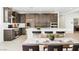 Open-concept kitchen with stainless steel appliances and large island at 1005 Warsaw Ave, Henderson, NV 89015