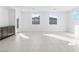 Bright living room with gray cabinets, tile floors, and two large windows providing ample light at 1005 Warsaw Ave, Henderson, NV 89015