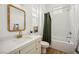 bathroom with white subway tile, bright mirror and vanity, and shower at 10420 Luella Ct, Las Vegas, NV 89143