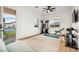 Bright home gym with weight rack, blue yoga mat, ceiling fan and view of a tennis court at 10420 Luella Ct, Las Vegas, NV 89143