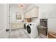 Well-equipped laundry room featuring modern appliances, ample storage, and a clean, functional design at 10420 Luella Ct, Las Vegas, NV 89143