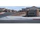 Street view of the Homestead Ranch II community entrance with landscaped median at 10420 Luella Ct, Las Vegas, NV 89143
