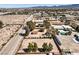 Expansive aerial view of a Nevada property showing outbuildings, mature trees, and a large yard at 10615 Rancho Destino Rd, Las Vegas, NV 89183