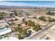 Aerial view showcases the neighborhood with views, the home's roof and generous surrounding lot size at 10615 Rancho Destino Rd, Las Vegas, NV 89183