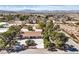 An aerial view of the house showing its mature landscaping, driveway and the expansive backyard space at 10615 Rancho Destino Rd, Las Vegas, NV 89183