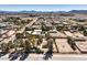 This aerial view shows the property with its big lot in a neighborhood with easy access to nearby highways at 10615 Rancho Destino Rd, Las Vegas, NV 89183