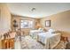 Neutral bedroom featuring two twin beds and large window at 10615 Rancho Destino Rd, Las Vegas, NV 89183