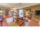 A dining room and kitchen combination with stainless steel appliances and wooden table set at 10615 Rancho Destino Rd, Las Vegas, NV 89183