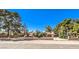 Charming single-story home with well-maintained landscaping and a classic brick fence, perfect for families at 10615 Rancho Destino Rd, Las Vegas, NV 89183