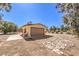 Single car garage with a gravel driveway at 10615 Rancho Destino Rd, Las Vegas, NV 89183
