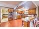 View of the kitchen area with stainless steel appliances and wooden cabinets at 10615 Rancho Destino Rd, Las Vegas, NV 89183