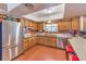 Kitchen with stainless steel appliances, tiled floors, and a window at 10615 Rancho Destino Rd, Las Vegas, NV 89183