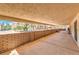 Covered patio with brick accent and concrete floor at 10615 Rancho Destino Rd, Las Vegas, NV 89183