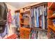 A well-organized walk-in closet provides custom shelving and hanging space for clothing and accessories at 10615 Rancho Destino Rd, Las Vegas, NV 89183