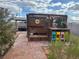 Backyard spa with an outdoor kitchen featuring colorful seating amid desert landscaping at 1201 Madison Ave, Las Vegas, NV 89106