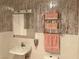Bathroom featuring pink accessories and patterned wall and floor tiles at 1201 Madison Ave, Las Vegas, NV 89106