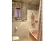 Bathroom featuring pink bathtub and fixtures with pink patterned walls and floor at 1201 Madison Ave, Las Vegas, NV 89106