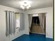 Bright bedroom with window, blue flooring, and closet at 1201 Madison Ave, Las Vegas, NV 89106