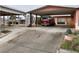 Spacious driveway leading to a carport with a covered entrance to the home at 1201 Madison Ave, Las Vegas, NV 89106