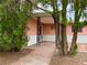 Charming home with stucco siding, a covered entrance, and desert landscaping at 1201 Madison Ave, Las Vegas, NV 89106
