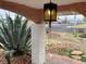 Covered front porch with unique lighting and desert landscaping at 1201 Madison Ave, Las Vegas, NV 89106
