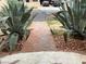 Pathway leads to gate and front yard with succulent landscaping at 1201 Madison Ave, Las Vegas, NV 89106