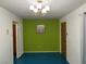 Hallway featuring green accent wall and vintage doors at 1201 Madison Ave, Las Vegas, NV 89106