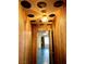 Hallway with vinyl record decorated ceiling and floral patterned walls at 1201 Madison Ave, Las Vegas, NV 89106