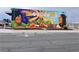 Vibrant mural showcasing local art and culture in the neighborhood with portraits and agriculture at 1201 Madison Ave, Las Vegas, NV 89106
