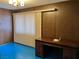 Retro office with wood paneling, large vertical blinds, and built-in desk at 1201 Madison Ave, Las Vegas, NV 89106