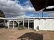 Covered patio with desert landscaping, a glimpse of the street, and blue skies at 1201 Madison Ave, Las Vegas, NV 89106