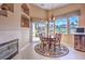 Breakfast nook with cozy fireplace and neighborhood views at 1363 Rolling Sunset St, Henderson, NV 89052