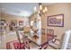 Dining room with chandelier and view into living room at 1363 Rolling Sunset St, Henderson, NV 89052