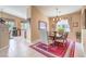 Dining room with tile flooring, chandelier, and views of the backyard at 1363 Rolling Sunset St, Henderson, NV 89052