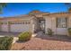 Attractive single-story home with a three-car garage, desert landscaping, and a welcoming entrance with double glass doors at 1363 Rolling Sunset St, Henderson, NV 89052