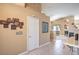 Hallway with tile floors showcasing the neutral wall paint, decorative paintings, and art pieces adorning the wall at 1363 Rolling Sunset St, Henderson, NV 89052