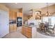 Kitchen with view to living room and breakfast nook area at 1363 Rolling Sunset St, Henderson, NV 89052