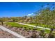 Stunning community landscape featuring lush greenery, mature trees, and well-maintained walking paths at 1363 Rolling Sunset St, Henderson, NV 89052