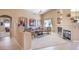 Spacious living room featuring neutral decor, built-in shelving, a fireplace, and comfortable seating, and lots of natural light at 1363 Rolling Sunset St, Henderson, NV 89052